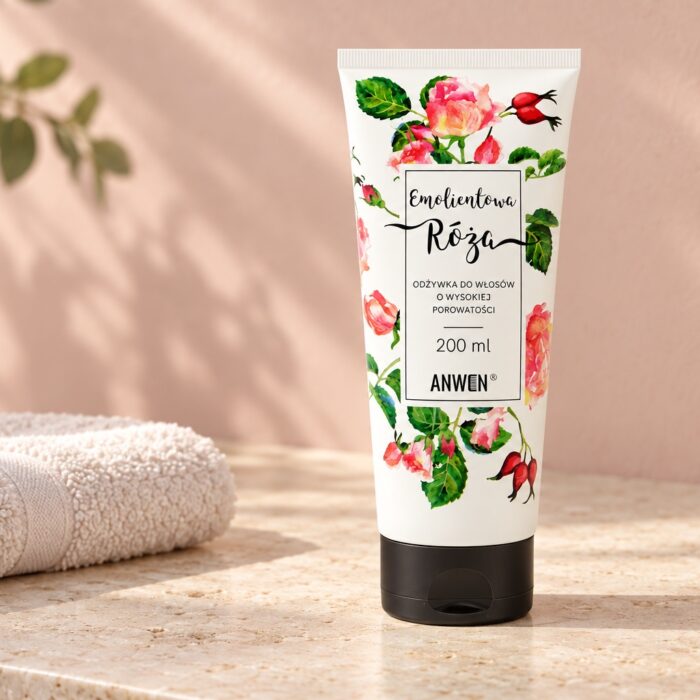 Tubka odżywki Anwen Emolientowa Róża 200 ml na jasnym blacie obok ręcznika
