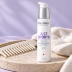 Serum Goldwell Just Smooth 6 Effects 100 ml na kamiennej tacy obok grzebienia