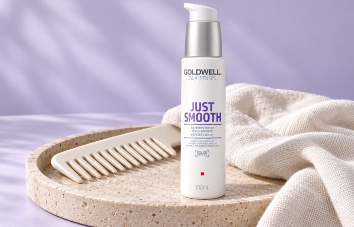 Serum Goldwell Just Smooth 6 Effects 100 ml na kamiennej tacy obok grzebienia