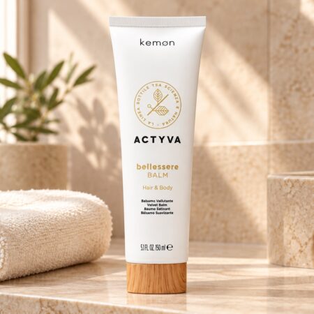 Biała tuba Kemon Actyva Bellessere Balm 150 ml na łazienkowej półce obok jasnego ręcznika.