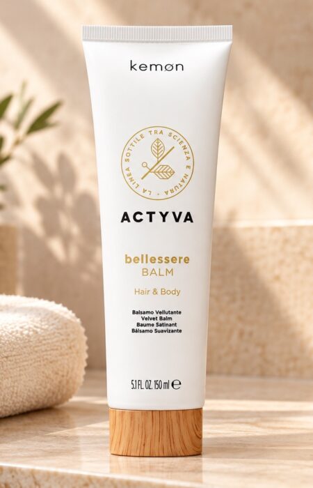 Biała tuba Kemon Actyva Bellessere Balm 150 ml na łazienkowej półce obok jasnego ręcznika.