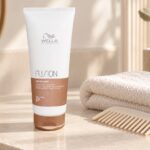 Tuba odżywki Wella Fusion 200 ml obok ręcznika i grzebienia